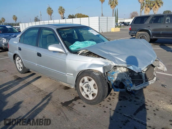 1999 Honda Civic EX with VIN JHMEJ8648XS000823, listed as a IAAI auction lot 41479594 with 299,294 mi miles. Bid and sale history available at carsss.com. Image 1.