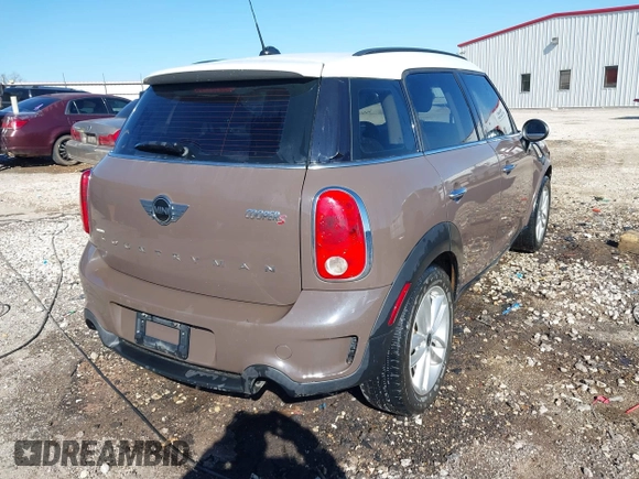 2014 MINI Countryman S with VIN WMWZC3C5XEWP52054, listed as a IAAI auction lot 41452354 with 104,873 mi miles and . Bid and sale history available at DreamBid. Image 4.