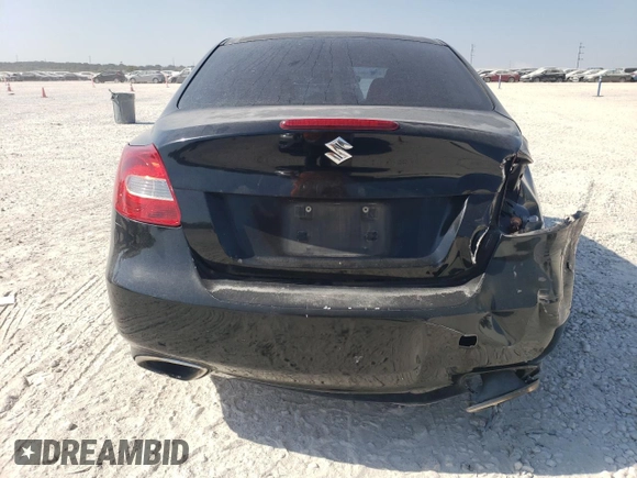 2011 Suzuki Kizashi SE z VIN JS2RE9A34B6111601, wystawiony jako Copart lot #75945784 z przebiegiem 128 926 mil mil oraz Szkoda całkowita • Salvage title. Historia ofert i sprzedaży dostępna na DreamBid. Obrazek 6.