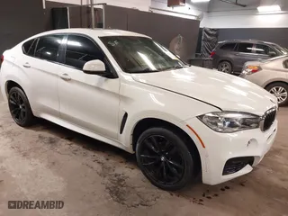 2019 BMW X6 sDrive35i with VIN 5UXKU0C5XK0S97686, listed as a IAAI auction lot 40436492 with 105,584 mi miles. Bid and sale history available at carsss.com. Image 1.