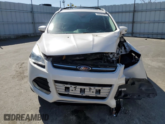2016 Ford Escape Titanium with VIN 1FMCU0J99GUB83458, listed as a Copart auction lot 48828195 with 74,250 mi miles and Salvage Title. Bid and sale history available at carsss.com. Image 5.
