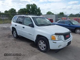 2003 GMC Envoy SLT with VIN 1GKDS13S732379218, listed as a IAAI auction lot 42164368 with Not Provided miles. Bid and sale history available at carsss.com. Image 1.