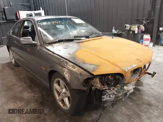 2001 BMW 3 Series 325Ci with VIN WBABN33471JW48292, listed as a IAAI auction lot 41557412 with 118,000 mi miles. Bid and sale history available at carsss.com. Image 1.