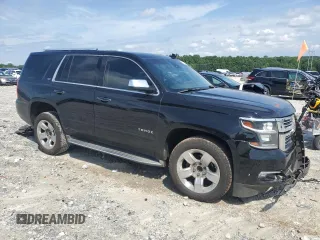 2015 Chevrolet Tahoe LTZ with VIN 1GNSCCKC2FR693500, listed as a Copart auction lot 60225195 with 206,210 mi miles and Salvage title. Bid and sale history available at DreamBid. Image 4.