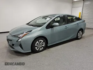 2016 Toyota Prius Four z VIN JTDKARFU1G3518311, wystawiony jako Copart lot #57559815 z przebiegiem 143 252 mil mil oraz Czysty tytuł • Clean title. Historia ofert i sprzedaży dostępna na DreamBid. Obrazek 1.