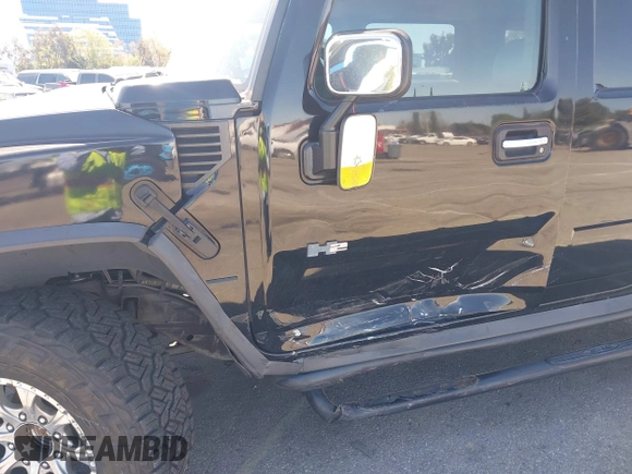 2003 Hummer H2 z VIN 5GRGN23U63H117676, wystawiony jako IAAI lot #41816411 z przebiegiem Nie podano mil oraz . Historia ofert i sprzedaży dostępna na DreamBid. Obrazek 6.