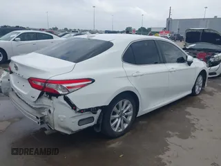 2020 Toyota Camry LE with VIN 4T1C11AK3LU361294, listed as a IAAI auction lot 41915072 with 107,682 mi miles. Bid and sale history available at carsss.com. Image 4.