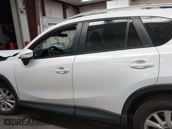 2016 Mazda CX-5 Sport with VIN JM3KE2BY8G0787130, listed as a IAAI auction lot 41847443 with 96,611 mi miles. Bid and sale history available at carsss.com. Image 14.
