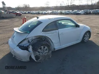2019 Volkswagen Beetle SE with VIN 3VWJD7AT6KM713525, listed as a IAAI auction lot 41508195 with 73,360 mi miles. Bid and sale history available at carsss.com. Image 4.