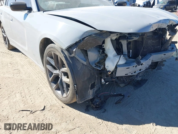 2022 Dodge Charger SXT with VIN 2C3CDXBG7NH208839, listed as a IAAI auction lot 41701171 with 71,552 mi miles and . Bid and sale history available at DreamBid. Image 6.