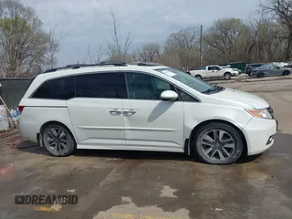 2014 Honda Odyssey Touring с VIN 5FNRL5H94EB057681, выставлен на аукционе IAAI как лот 41828000 с пробегом 249 350 миль миль и . История ставок и продаж доступна на DreamBid. Изображение 14.