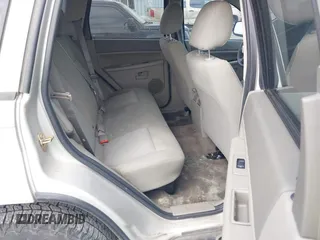 2007 Jeep Grand Cherokee Laredo z VIN 1J8GR48K57C605912, wystawiony jako IAAI lot #42323050 z przebiegiem 210 615 mil mil oraz . Historia ofert i sprzedaży dostępna na DreamBid. Obrazek 8.