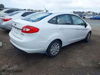 2013 Ford Fiesta S with VIN 3FADP4AJ3DM153816, listed as a IAAI auction lot 41598766 with 64,808 mi miles. Bid and sale history available at carsss.com. Image 4.