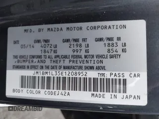 2014 Mazda 3 s Touring with VIN JM1BM1L35E1208952, listed as a IAAI auction lot 42121077 with 183,985 mi miles. Bid and sale history available at carsss.com. Image 9.