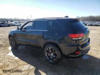 2015 Jeep Grand Cherokee SRT with VIN 1C4RJFDJ1FC663370, listed as a Copart auction lot 86608514 with 123,209 mi miles and Salvage Title. Bid and sale history available at carsss.com. Image 2.