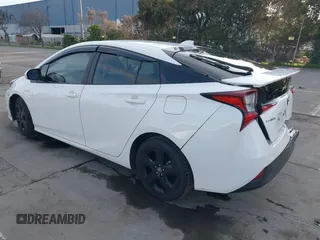 2021 Toyota Prius L Eco z VIN JTDKAMFU9M3131228, wystawiony jako IAAI lot #41257117 z przebiegiem 72 840 mil mil oraz . Historia ofert i sprzedaży dostępna na DreamBid. Obrazek 3.