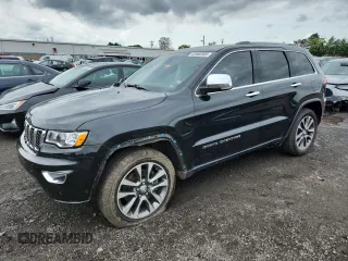 2018 Jeep Grand Cherokee Limited with VIN 1C4RJFBM1JC393840, listed as a Copart auction lot 63982305 with 107,300 mi miles and Salvage title. Bid and sale history available at DreamBid. Image 1.