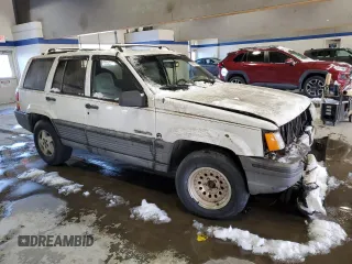 1993 Jeep Grand Cherokee Laredo with VIN 1J4GZ58Y2PC658787, listed as a Copart auction lot 41687765 with 166,262 mi miles and Salvage Title. Bid and sale history available at carsss.com. Image 4.