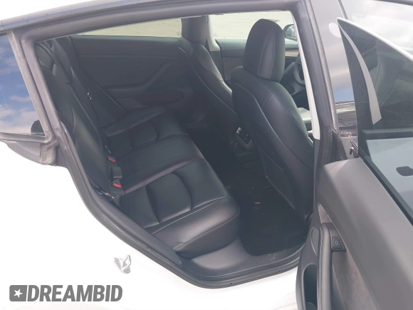 2021 Tesla Model 3 Long Range with VIN 5YJ3E1EB9MF059554, listed as a IAAI auction lot 41231520 with 63,696 mi miles and . Bid and sale history available at DreamBid. Image 8.