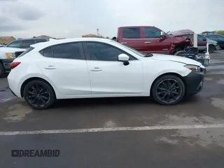 2016 Mazda 3 S Grand Touring z VIN JM1BM1N36G1344247, wystawiony jako IAAI lot #41382859 z przebiegiem 40 710 mil mil oraz . Historia ofert i sprzedaży dostępna na DreamBid. Obrazek 13.