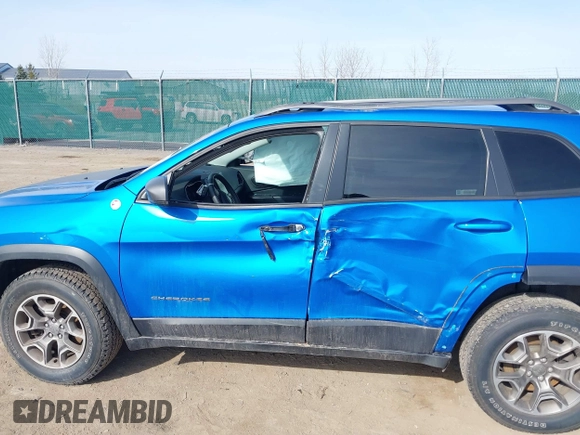 2021 Jeep Cherokee Trailhawk with VIN 1C4PJMBX4MD222987, listed as a IAAI auction lot 41771808 with 52,533 mi miles and . Bid and sale history available at DreamBid. Image 6.