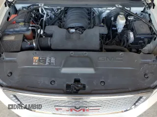 2015 GMC Yukon Denali with VIN 1GKS2CKJ7FR266750, listed as a Copart auction lot 47882125 with 121,705 mi miles and Salvage Title. Bid and sale history available at carsss.com. Image 13.
