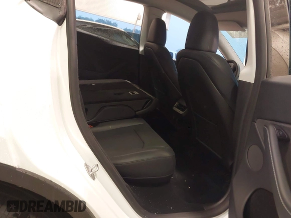 2023 Tesla Model Y Long Range with VIN 7SAYGDEE3PA206757, listed as a IAAI auction lot 39425483 with 5,711 mi miles and . Bid and sale history available at DreamBid. Image 8.