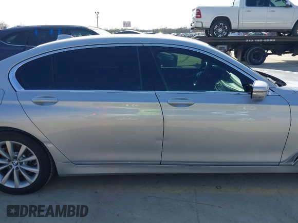 2016 BMW 7 Series 740i with VIN WBA7E2C5XGG739099, listed as a IAAI auction lot 41526038 with 123,900 mi miles. Bid and sale history available at carsss.com. Image 13.