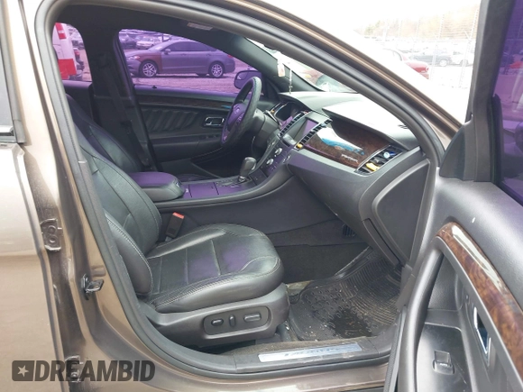 2015 Ford Taurus Limited with VIN 1FAHP2J84FG110702, listed as a IAAI auction lot 42060437 with 208,012 mi miles. Bid and sale history available at carsss.com. Image 5.