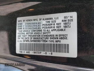 2014 Honda Odyssey Touring with VIN 5FNRL5H90EB077054, listed as a IAAI auction lot 41904456 with 197,869 mi miles and . Bid and sale history available at carsss.com. Image 9.