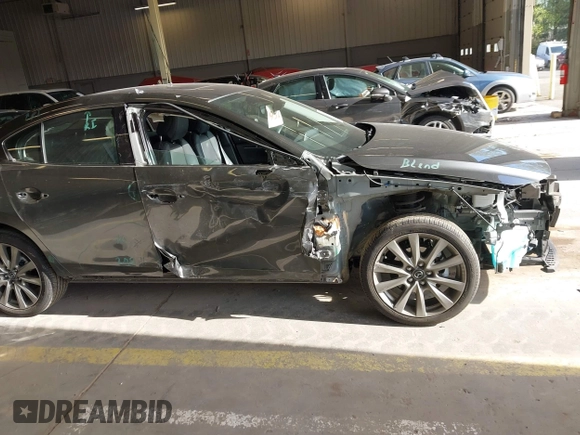 2023 Mazda 3 S Premium with VIN 3MZBPBDM5PM374492, listed as a IAAI auction lot 42025207 with 12,344 mi miles and . Bid and sale history available at DreamBid. Image 14.