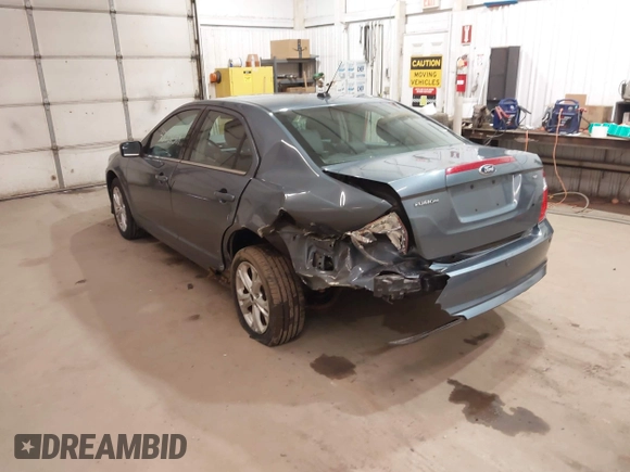 2012 Ford Fusion SE z VIN 3FAHP0HA9CR180004, wystawiony jako IAAI lot #42037384 z przebiegiem 111 262 mil mil oraz . Historia ofert i sprzedaży dostępna na DreamBid. Obrazek 3.