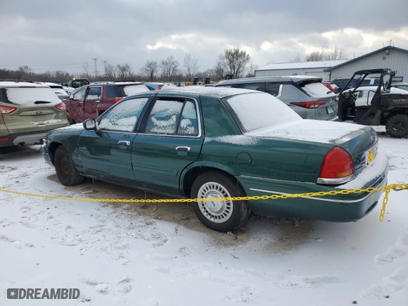 2000 Ford Crown Victoria with VIN 2FAFP73WXYX157746, listed as a Copart auction lot 82748804 with 56,820 mi miles and Salvage Title. Bid and sale history available at carsss.com. Image 2.