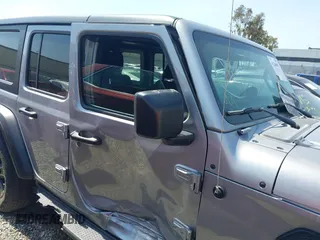 2021 Jeep Wrangler Unlimited Sport Altitude with VIN 1C4HJXDGXMW662493, listed as a IAAI auction lot 41288957 with 64,808 mi miles and . Bid and sale history available at DreamBid. Image 14.