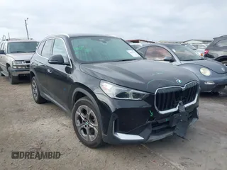 2023 BMW X1 xDrive28i with VIN WBX73EF04P5W37659, listed as a IAAI auction lot 42167511 with 36,820 mi miles. Bid and sale history available at carsss.com. Image 1.