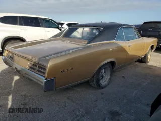 1967 Pontiac GTO z VIN 242177P108834, wystawiony jako Copart lot #74698414 z przebiegiem 230 374 mil mil oraz Szkoda całkowita • Salvage title. Historia ofert i sprzedaży dostępna na DreamBid. Obrazek 3.