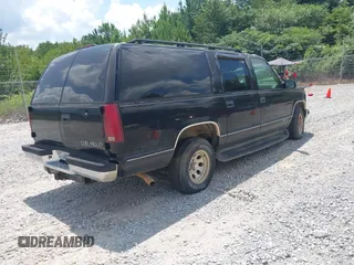 1996 Chevrolet Suburban with VIN 3GNEC16R3TG120004, listed as a IAAI auction lot 42752410 with 291,491 mi miles and . Bid and sale history available at DreamBid. Image 4.