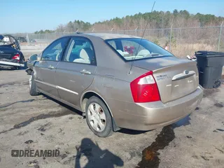 2004 Kia Spectra LX with VIN KNAFE121745039519, listed as a IAAI auction lot 41482402 with 201,123 mi miles. Bid and sale history available at carsss.com. Image 3.