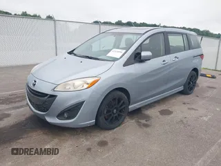 2012 Mazda 5 Touring with VIN JM1CW2CL7C0115096, listed as a IAAI auction lot 42524956 with 173,155 mi miles and . Bid and sale history available at DreamBid. Image 2.