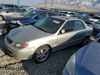 2003 Mazda Protege DX with VIN JM1BJ225431109585, listed as a Copart auction lot 88652505 with 246,348 mi miles and Salvage Title. Bid and sale history available at DreamBid. Image 1.