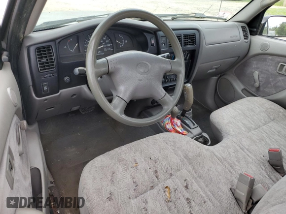 2001 Toyota Tacoma z VIN 5TEPM62N71Z875981, wystawiony jako Copart lot #61310975 z przebiegiem 256 779 mil mil oraz Czysty tytuł • Clean title. Historia ofert i sprzedaży dostępna na DreamBid. Obrazek 8.