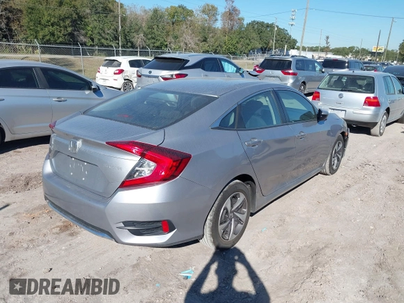 2020 Honda Civic LX with VIN 19XFC2F62LE009433, listed as a IAAI auction lot 40963670 with 117,865 mi miles and . Bid and sale history available at DreamBid. Image 4.