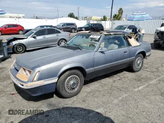 1986 Ford Mustang z VIN 1FABP2731GF272764, wystawiony jako Copart lot #73841704 z przebiegiem 11 671 mil mil oraz Czysty tytuł • Clean title. Historia ofert i sprzedaży dostępna na DreamBid. Obrazek 1.