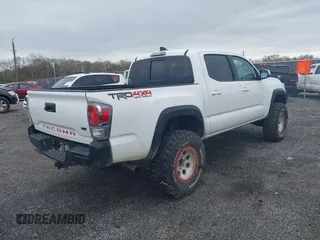 2023 Toyota Tacoma SR with VIN 3TMCZ5AN2PM641846, listed as a IAAI auction lot 41948660 with 21,969 mi miles and . Bid and sale history available at DreamBid. Image 4.