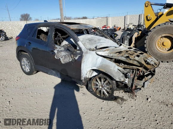 2015 Mazda CX-5 Touring with VIN JM3KE4CYXF0515106, listed as a Copart auction lot 50451185 with 0 mi miles and Salvage Title. Bid and sale history available at carsss.com. Image 4.