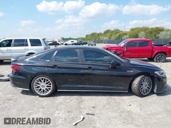 2019 Volkswagen Jetta GLI S with VIN 3VW5T7BU9KM142379, listed as a IAAI auction lot 42056617 with 77,283 mi miles and . Bid and sale history available at DreamBid. Image 13.