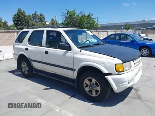 1999 Isuzu Rodeo S z VIN 4S2CM58WXX4347611, wystawiony jako IAAI lot #42351641 z przebiegiem 256 007 mil mil oraz . Historia ofert i sprzedaży dostępna na DreamBid. Obrazek 1.