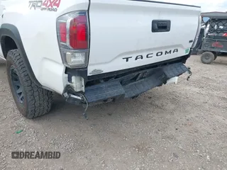 2022 Toyota Tacoma SR with VIN 3TMCZ5AN1NM478457, listed as a IAAI auction lot 42479107 with 59,547 mi miles and . Bid and sale history available at DreamBid. Image 6.