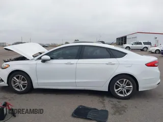 2018 Ford Fusion SE z VIN 3FA6P0H73JR212616, wystawiony jako IAAI lot #40869945 z przebiegiem 142 355 mil mil oraz . Historia ofert i sprzedaży dostępna na DreamBid. Obrazek 14.