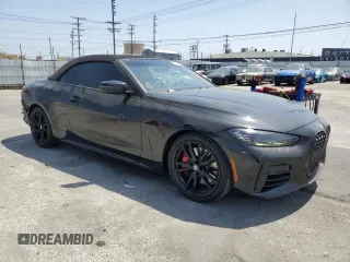 2022 BMW 4 Series M440i with VIN WBA53AT01NCJ52404, listed as a Copart auction lot 54464474 with 16,880 mi miles and Salvage title. Bid and sale history available at DreamBid. Image 4.